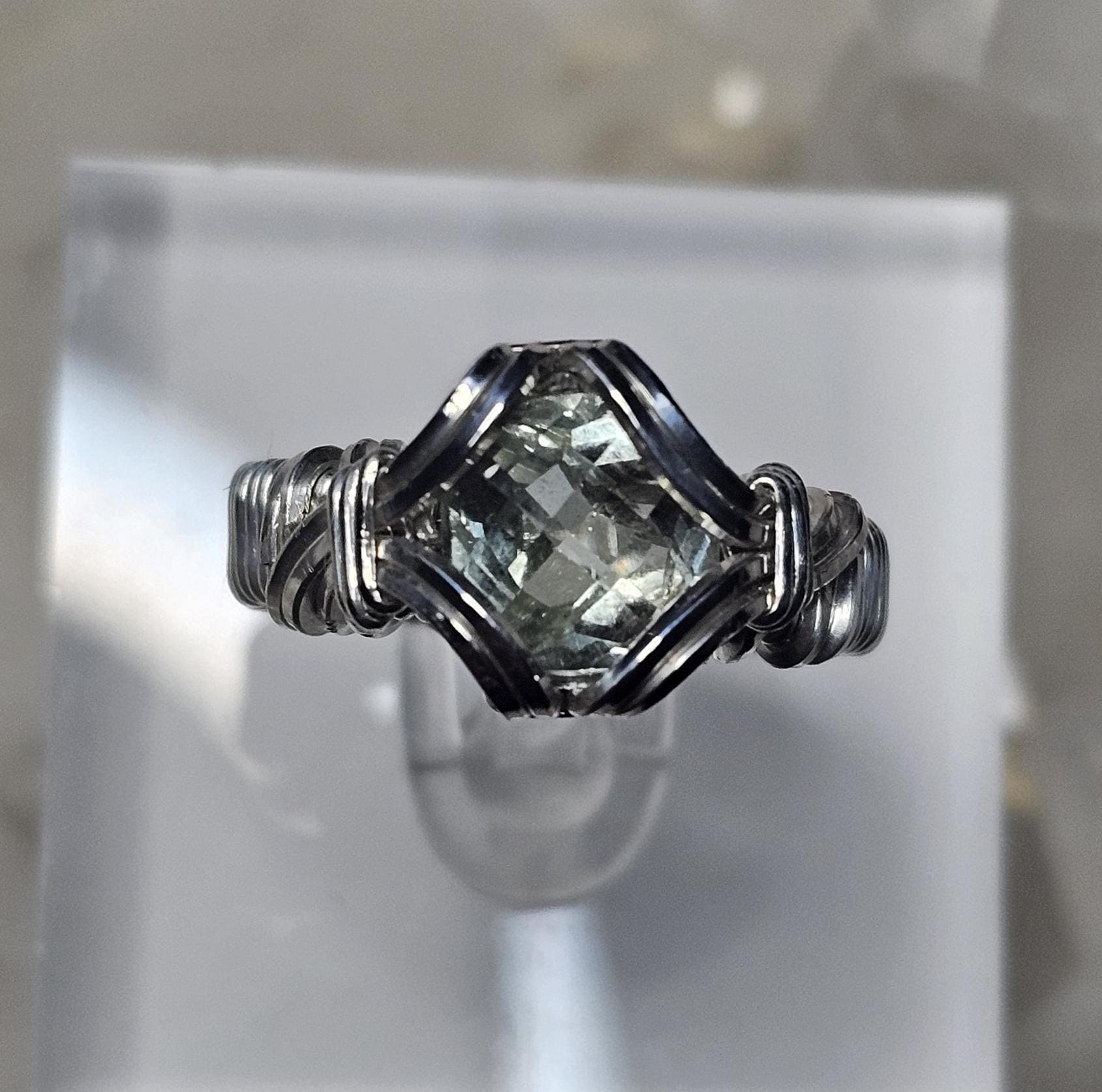 A faceted Green Amethyst, hand woven in sterling silver. Size 7.