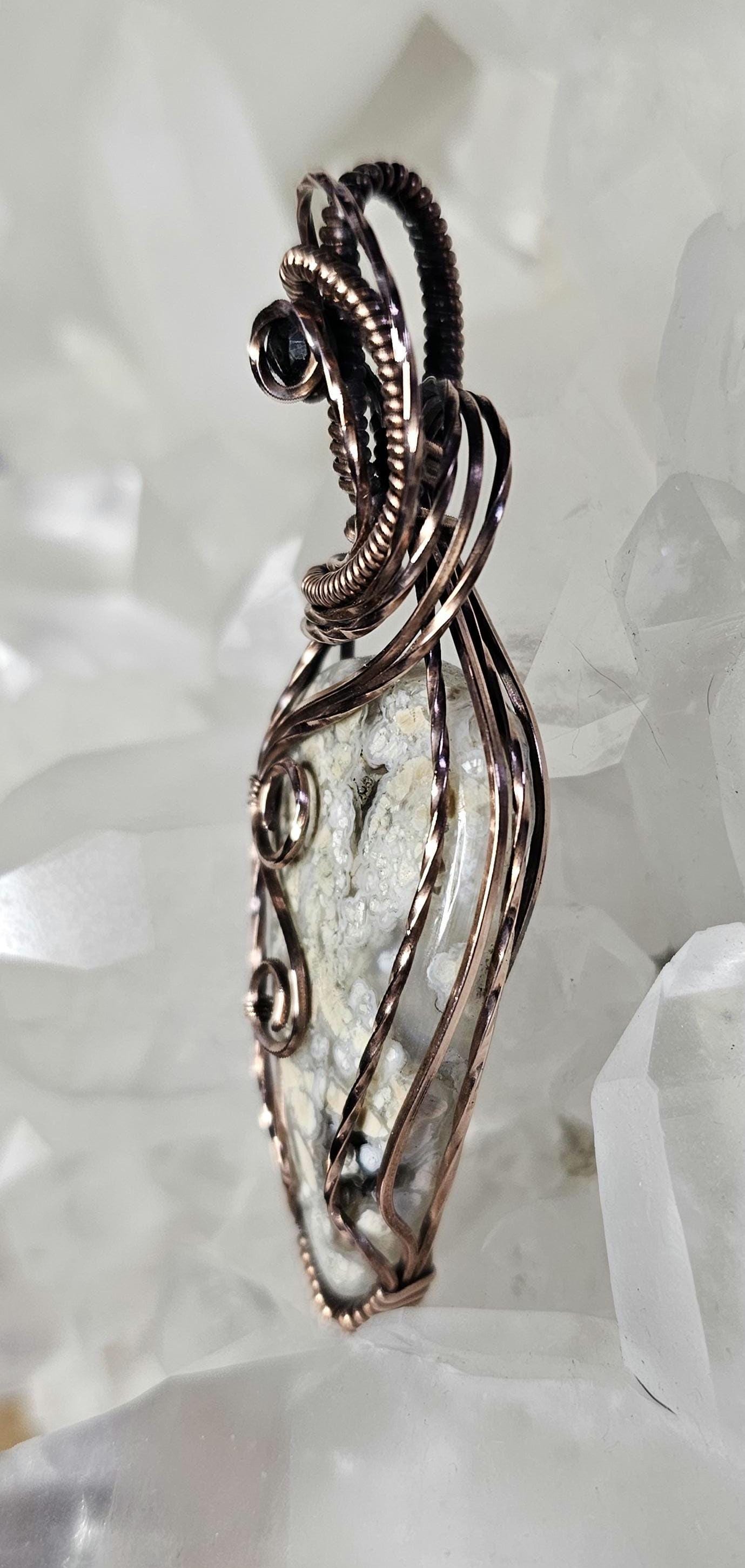 Brecciated Jasper, accented with a faceted onyx.