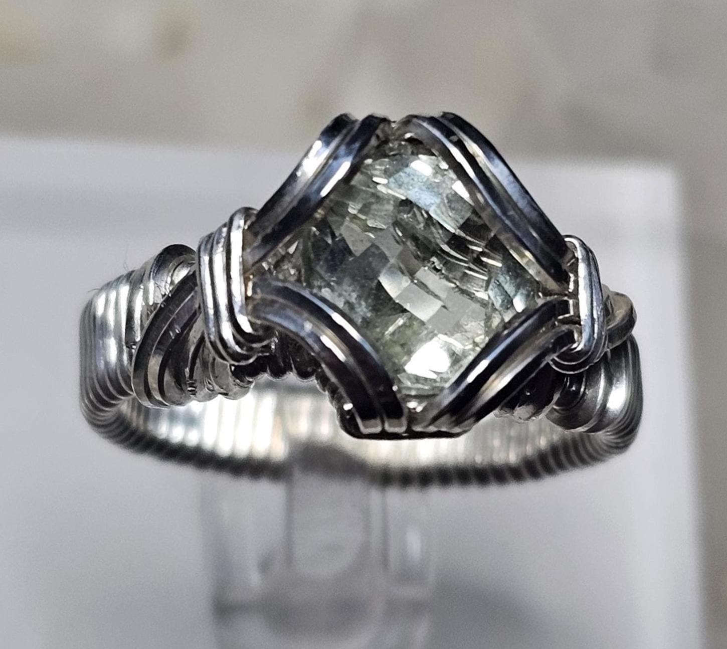A faceted Green Amethyst, hand woven in sterling silver. Size 7.