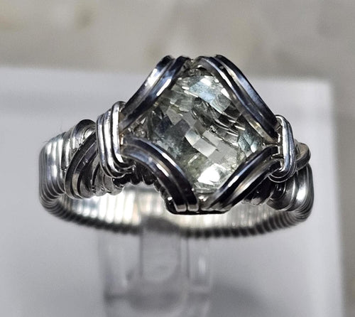 A faceted Green Amethyst, hand woven in sterling silver. Size 7.
