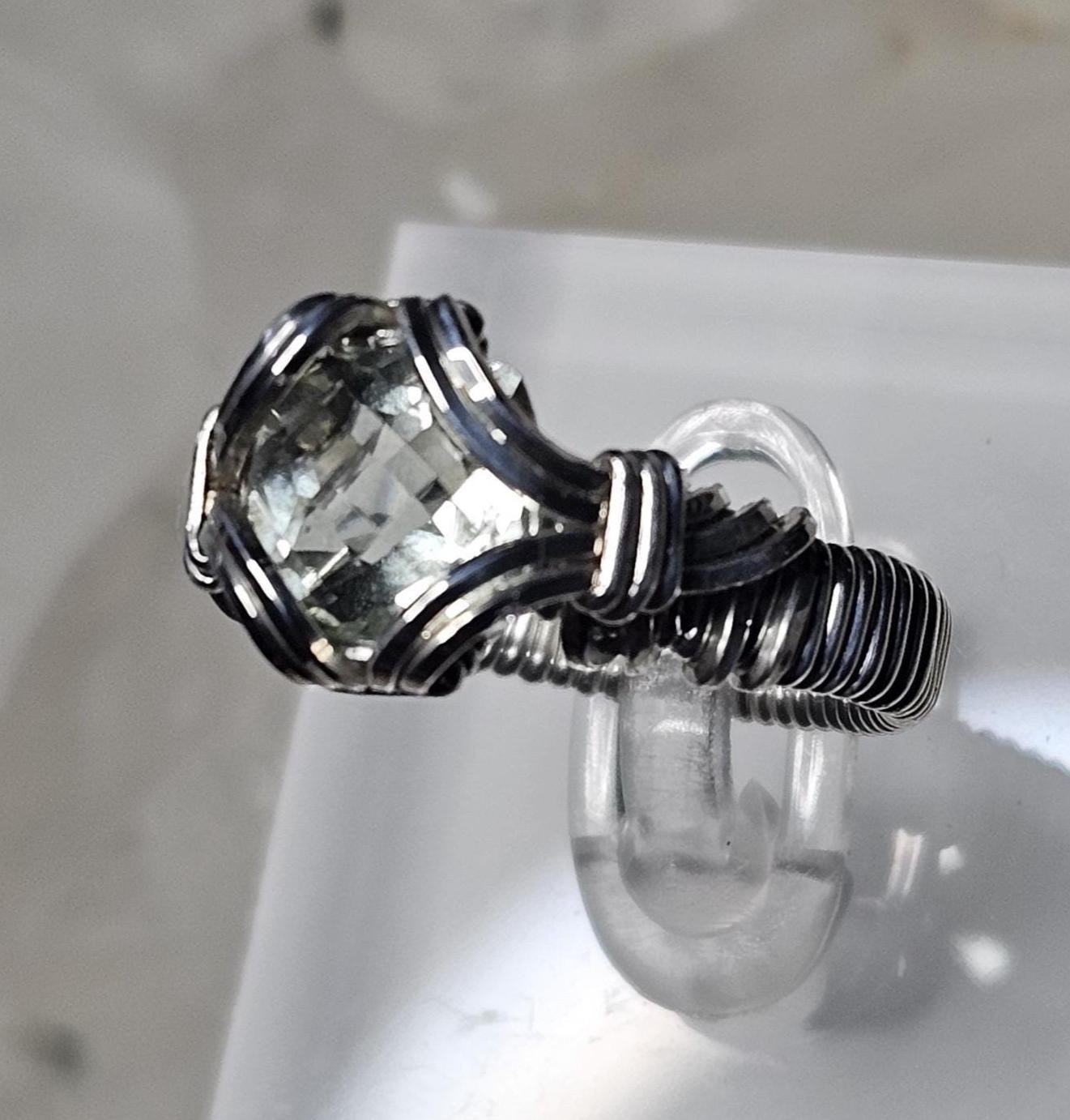 A faceted Green Amethyst, hand woven in sterling silver. Size 7.