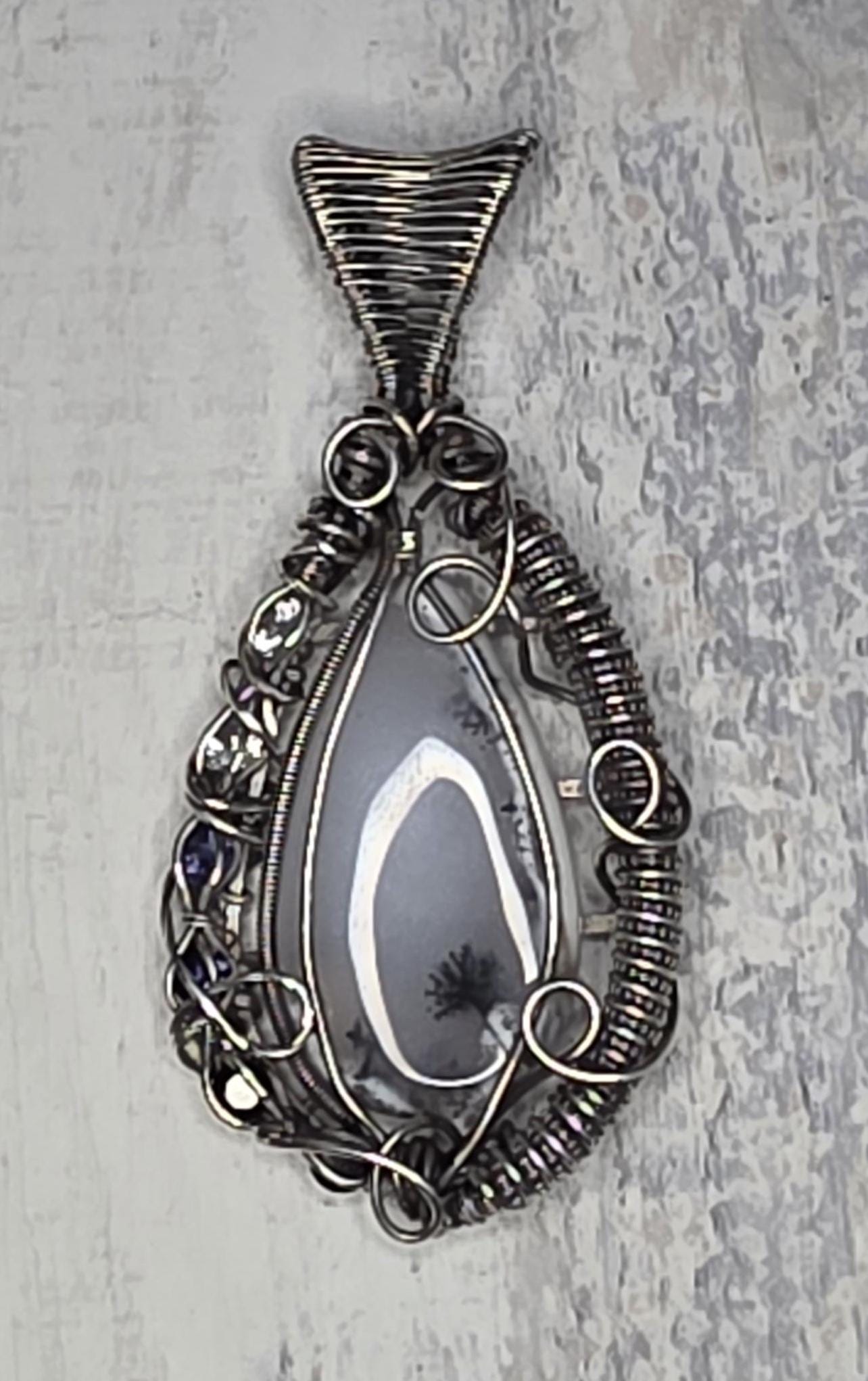 Merlinite Pendant: Hand Woven Sterling Silver, White Topaz Iolite & Onyx