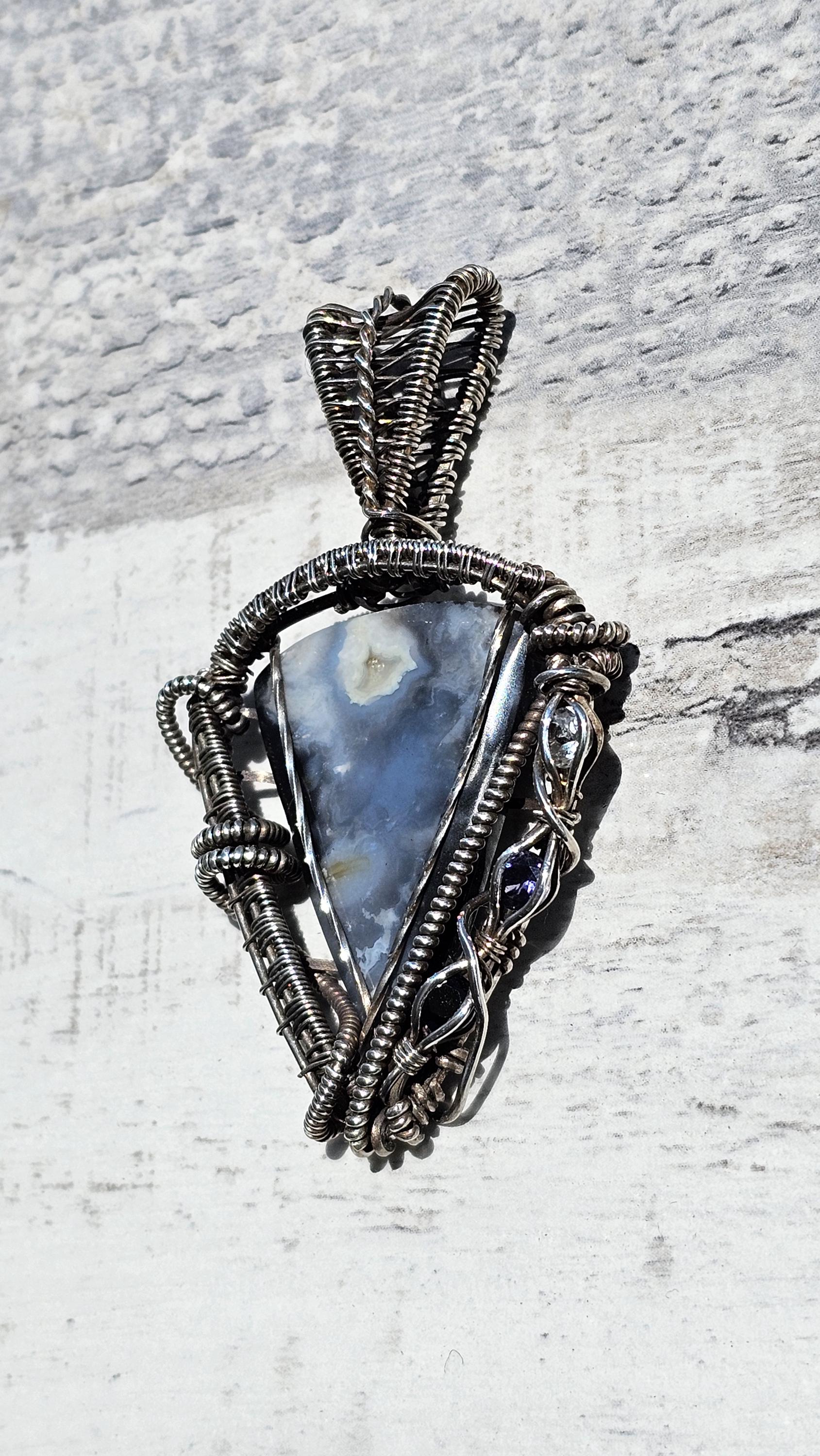 Stormy Plume Agate Pendant: Hand Woven Sterling Silver, Iolite & Onyx