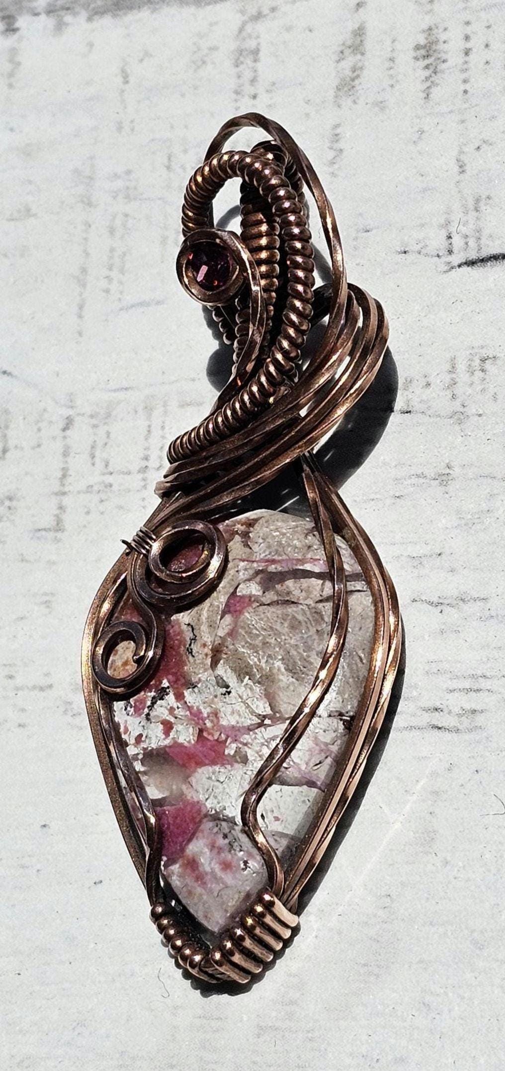 Cobaltian Calcite accented with a Raspberry Garnet, Hand Woven in Copper