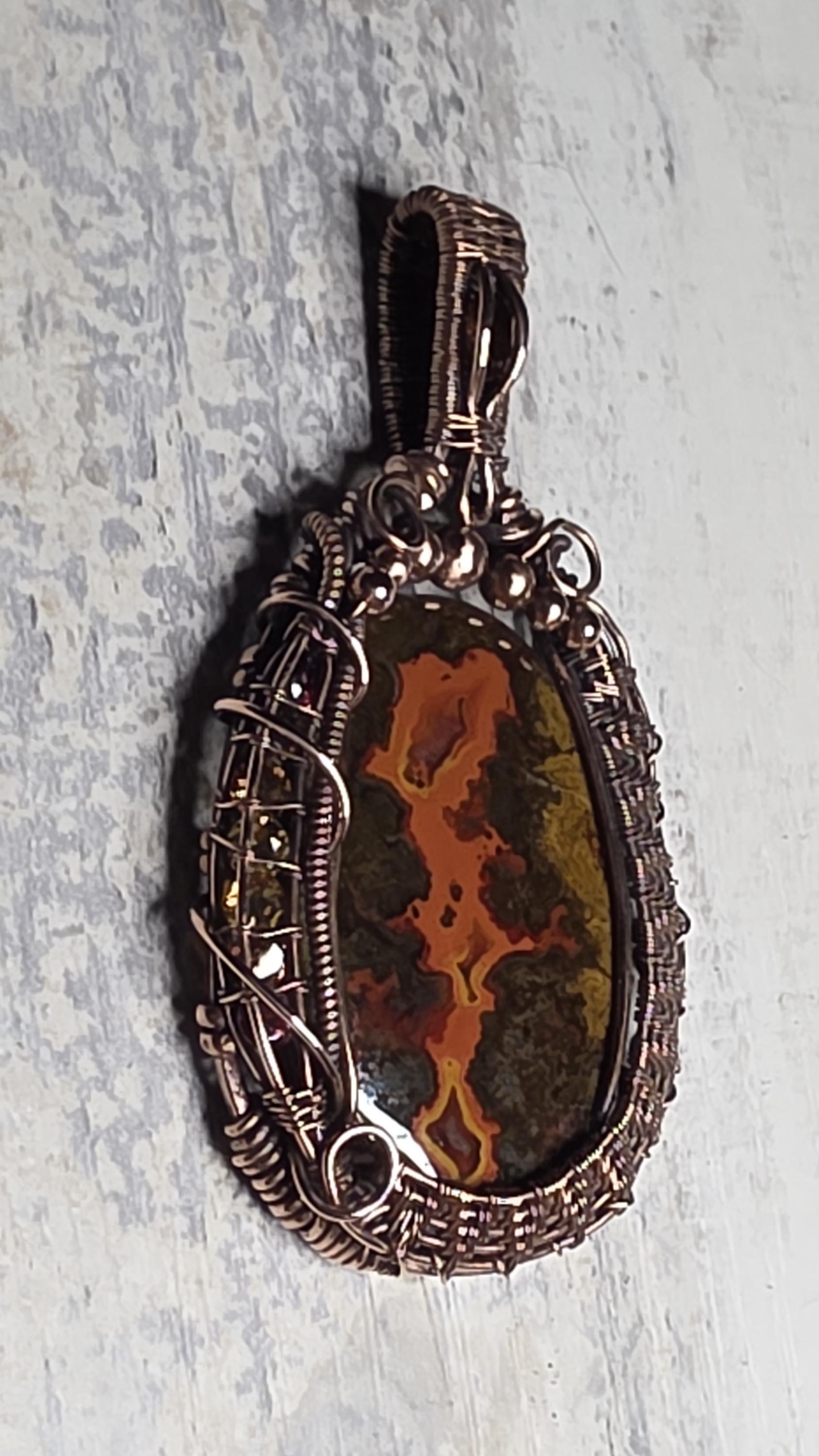 Moroccan Seam Agate wrapped in copper.