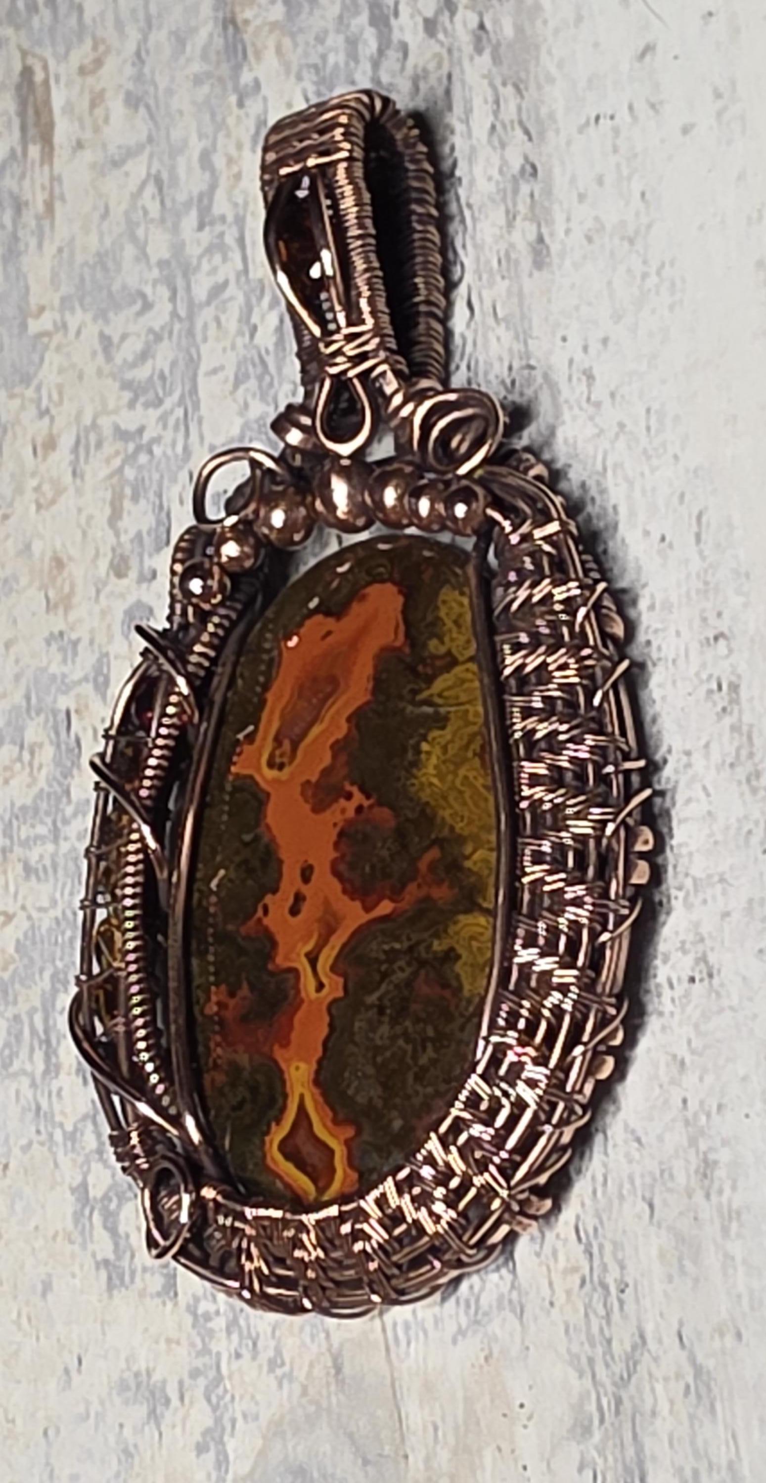 Moroccan Seam Agate wrapped in copper.